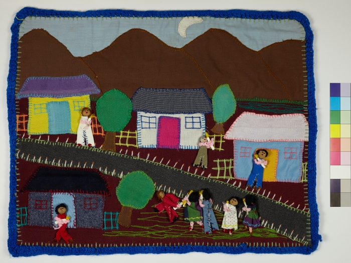 An Arpillera with four houses